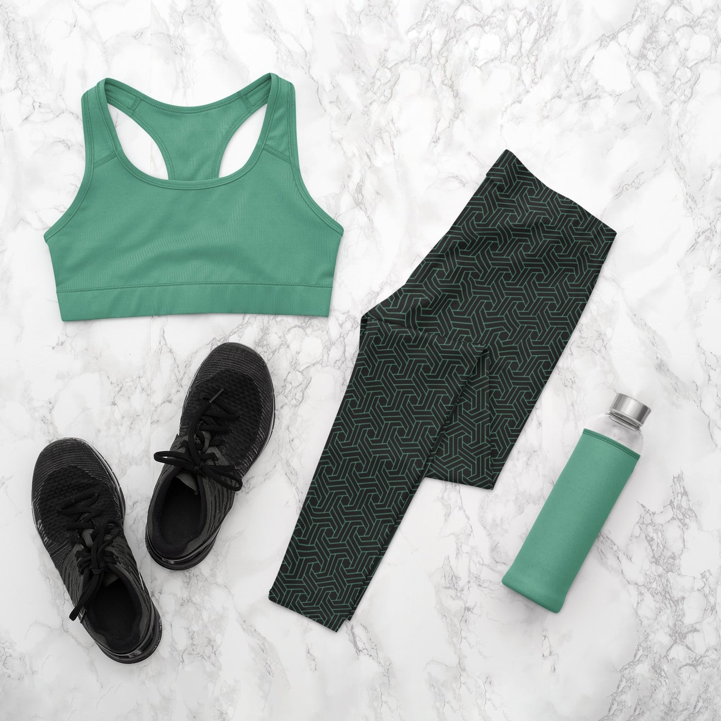 These custom handmade women's high waisted leggings are black in color with a glowing green geometric pattern overlayed on the top.