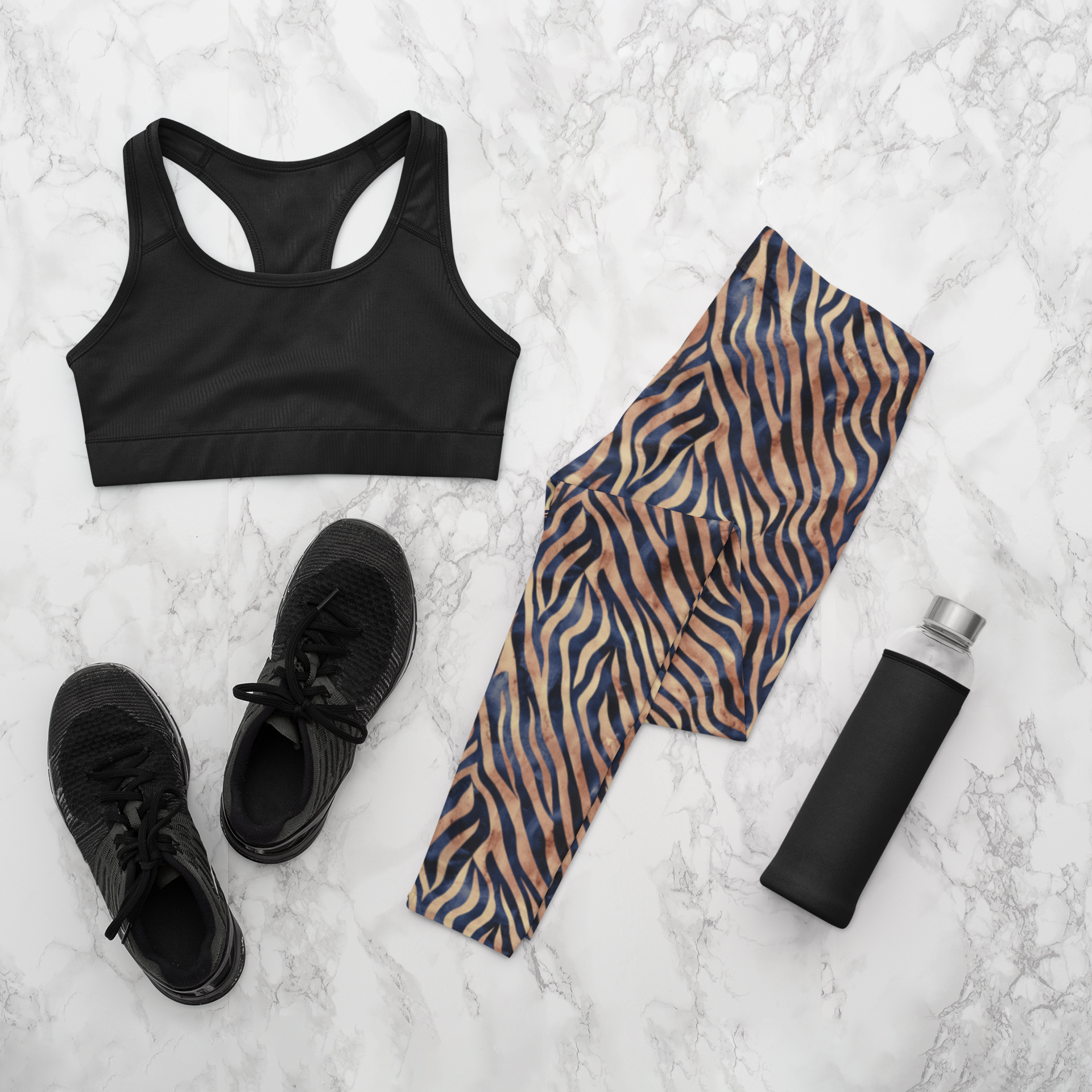 Custom women's high waisted leggings that are beige in color with black lines overtop that look like animal print like that of tigers.