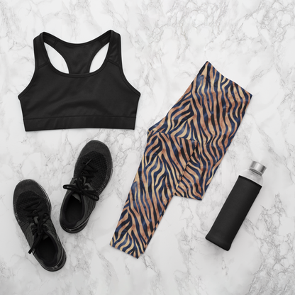 Custom women's high waisted leggings that are beige in color with black lines overtop that look like animal print like that of tigers.