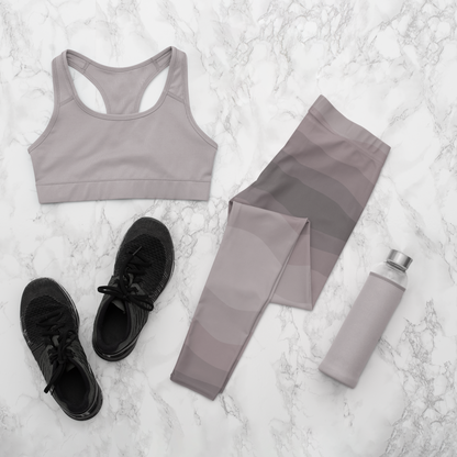 Custom high waisted women's leggings that have a wavy lines pattern that are all different shades of grey.