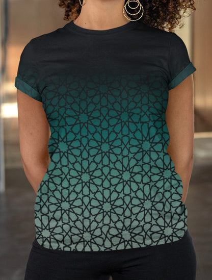 This super soft custom handmade women's tee has a unique and custom ombre floral design, with the top of the shirt being a dark jade green then it fades to a light green at the bottom, there is a dark jade green floral pattern overlayed across the entire shirt.