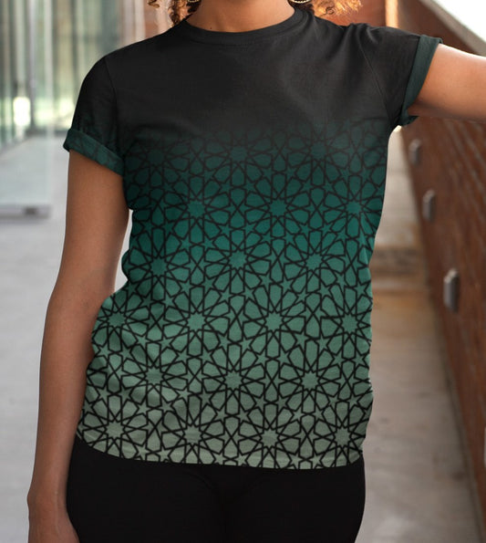 This super soft custom handmade women's tee has a unique and custom ombre floral design, with the top of the shirt being a dark jade green then it fades to a light green at the bottom, there is a dark jade green floral pattern overlayed across the entire shirt.