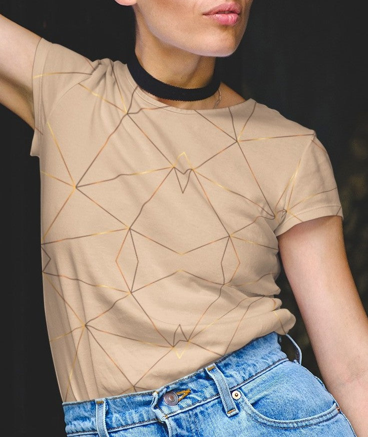 This custom women's handmade short sleeve shirt is a light beige color with with gold lines all over the shirt in a geometric pattern, some spots of the gold lines are brighter than others making it seem like the gold lines are glowing.