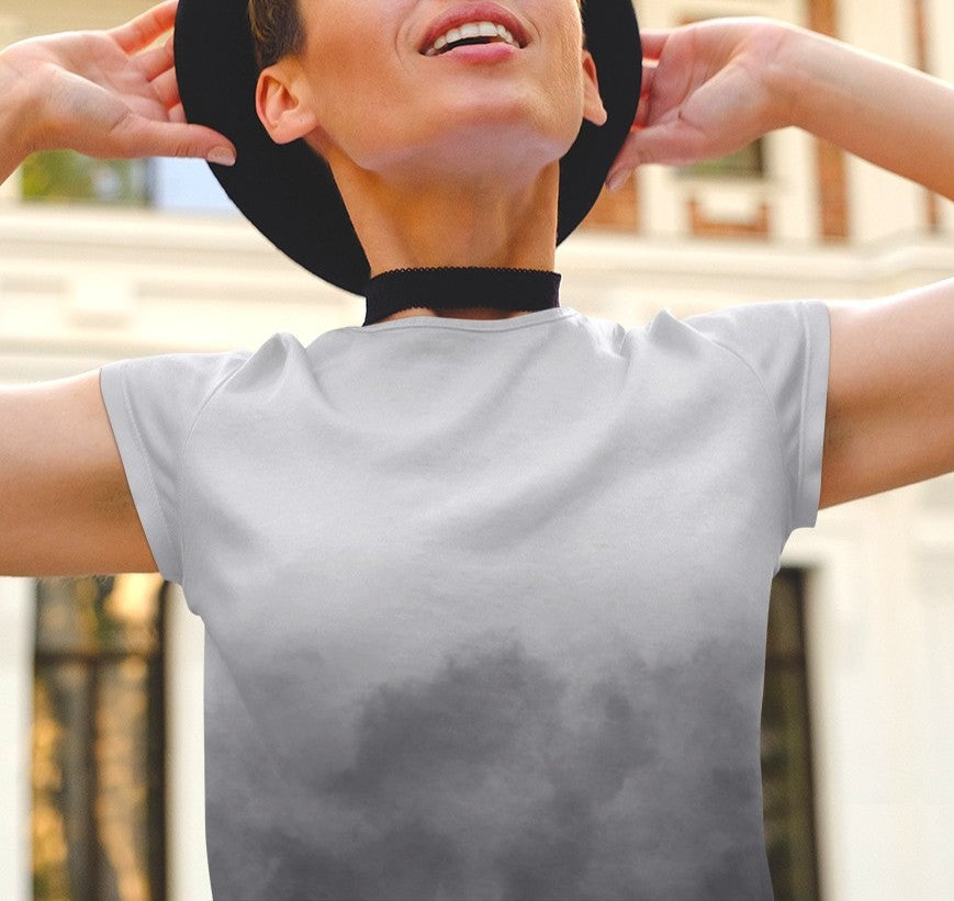 This custom women's short sleeve shirt has a very unique design with the top of the shirt being a light grey and the bottom is a dark slate grey that looks like it's smoke billowing up from the bottom of the shirt to the top of the shirt.