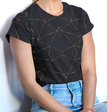This custom designed handmade women's t-shirt is all black with gold lines that are throughout the shirt in a geometric pattern, the lines are different shades of gold making it look like it is glowing.