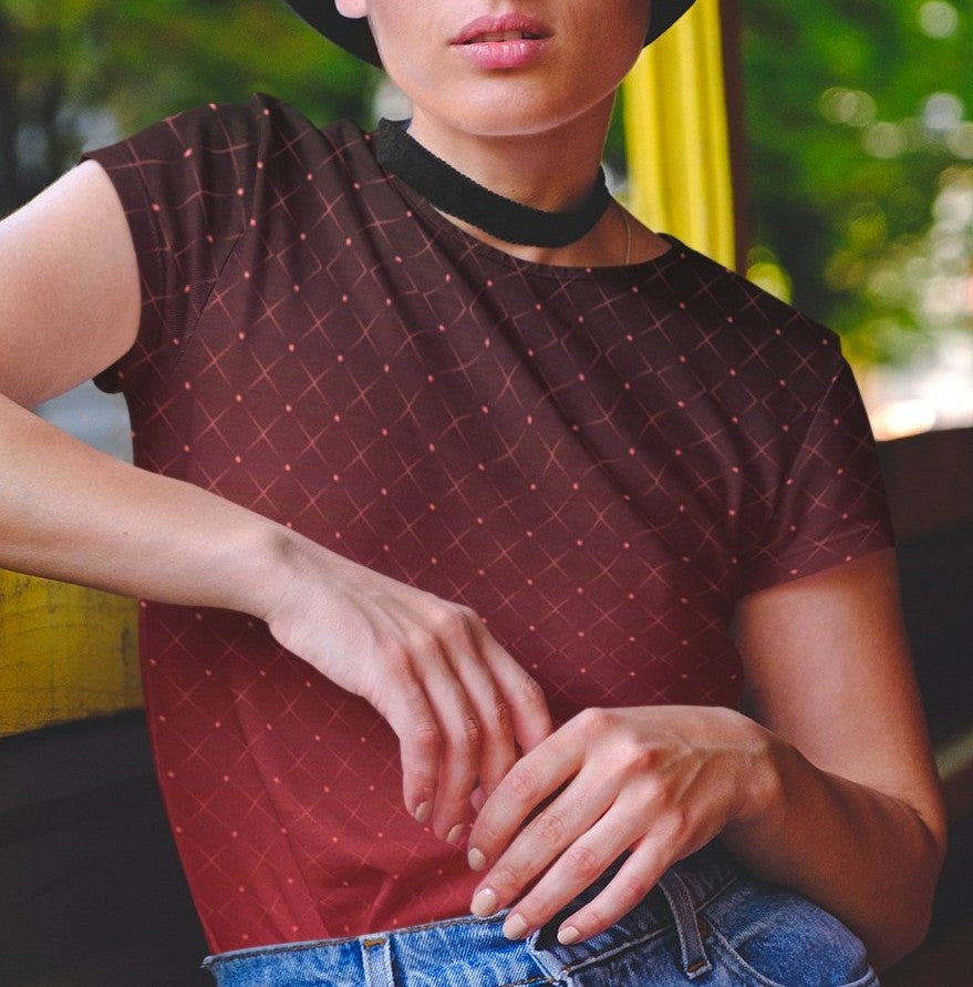 This completely custom women's shirt has a ombre pattern with it starting as a deep crimson red at the neckline of the shirt then fading to a bright red at the waistline, there is a crisscross pattern overlayed on the top in a light red color that makes the design look like it is glowing.