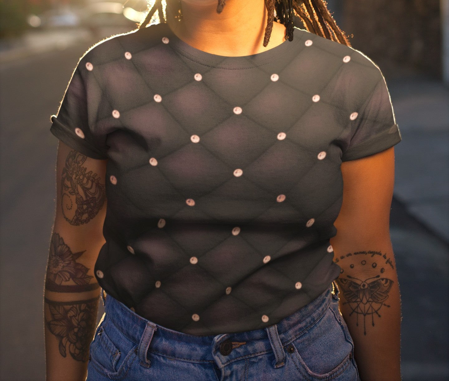 This custom handmade women's t-shirt is an eggplant purple color in a quilted pattern with diamonds on each intersecting line. The lines are a darker shade eggplant giving the shirt a 3d design.