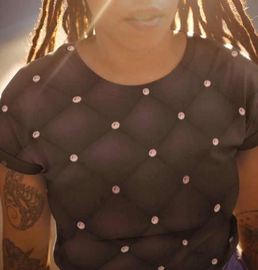 This custom handmade women's t-shirt is an eggplant purple color in a quilted pattern with diamonds on each intersecting line. The lines are a darker shade eggplant giving the shirt a 3d design.