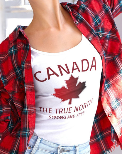 This custom unisex tank top has the word Canada in large block letters in a half circle on the top with a maple leaf underneath that, then under the the maple leaf are the words The True North Strong And Free in the same font, everything is a bright red color like the Canadian flag.