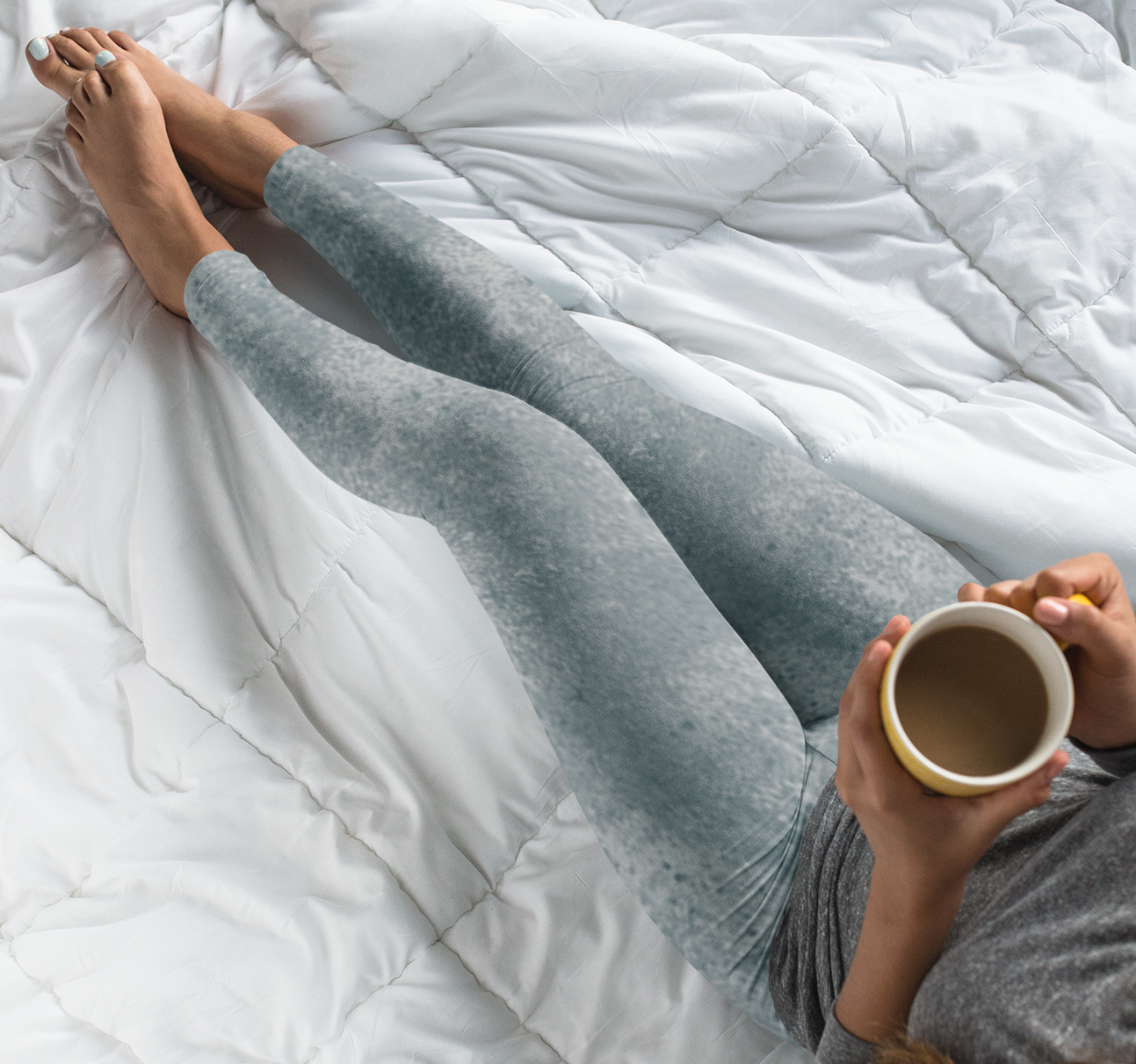 A pair of women's custom high waisted leggings, they have a washed grey pattern all over the pants.