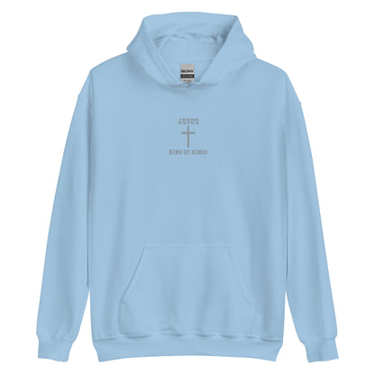 On the front of this custom embroidered unisex hooded sweatshirt are the words Jesus King of Kings with a Jesus cross in the center embroidered into the upper middle of the hoodie in silver thread.