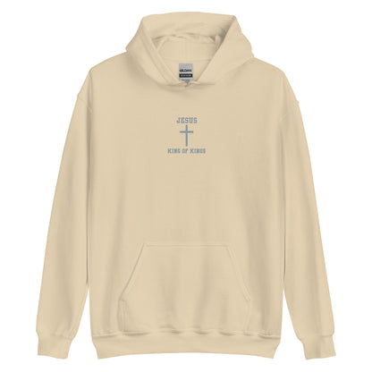 On the front of this custom embroidered unisex hooded sweatshirt are the words Jesus King of Kings with a Jesus cross in the center embroidered into the upper middle of the hoodie in silver thread.