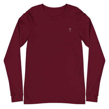 A classic unisex long sleeve Christian t-shirt features an embroidered white cross on the upper left chest of the shirt.