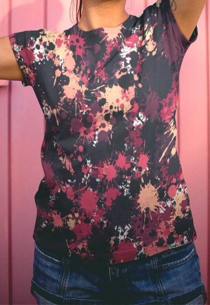 This completely custom super soft handmade women's t-shirt is all black with a bunch of different color paint splashes all over the shirt from red, pink, peach, burgundy, maroon and white. This shirt is perfect for painters or people who love art